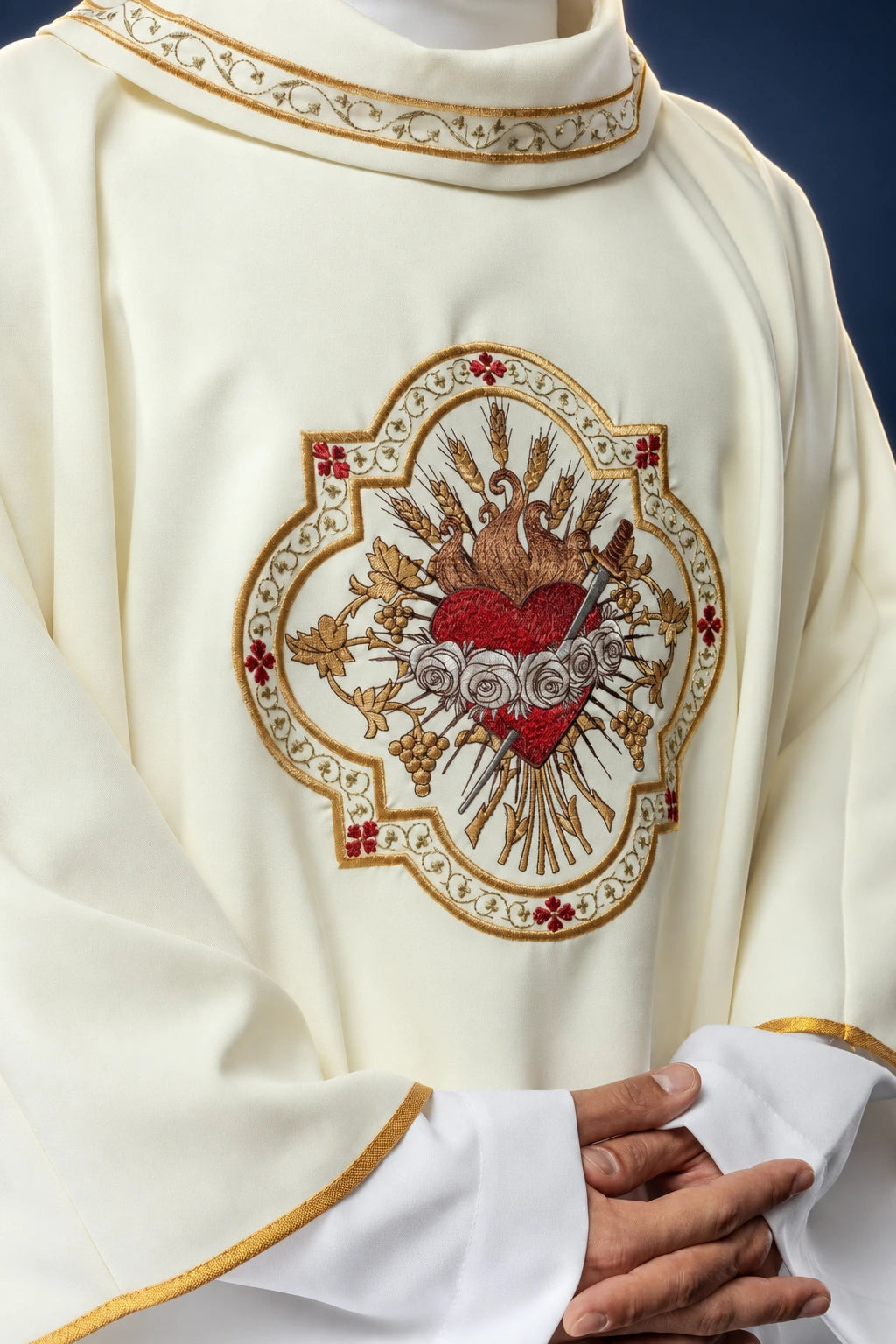 Front view of cream Catholic chasuble with embroidered Heart of Mary motif and gold trim at the collar and sleeves