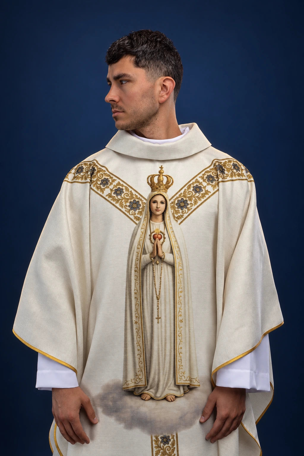 Front view of a cream chasuble with gold trim and a large Our Lady of Fatima print on the front