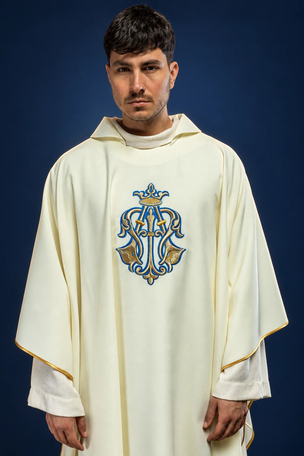 Front view of cream chasuble with wide ecru collar and Marian emblem embroidery