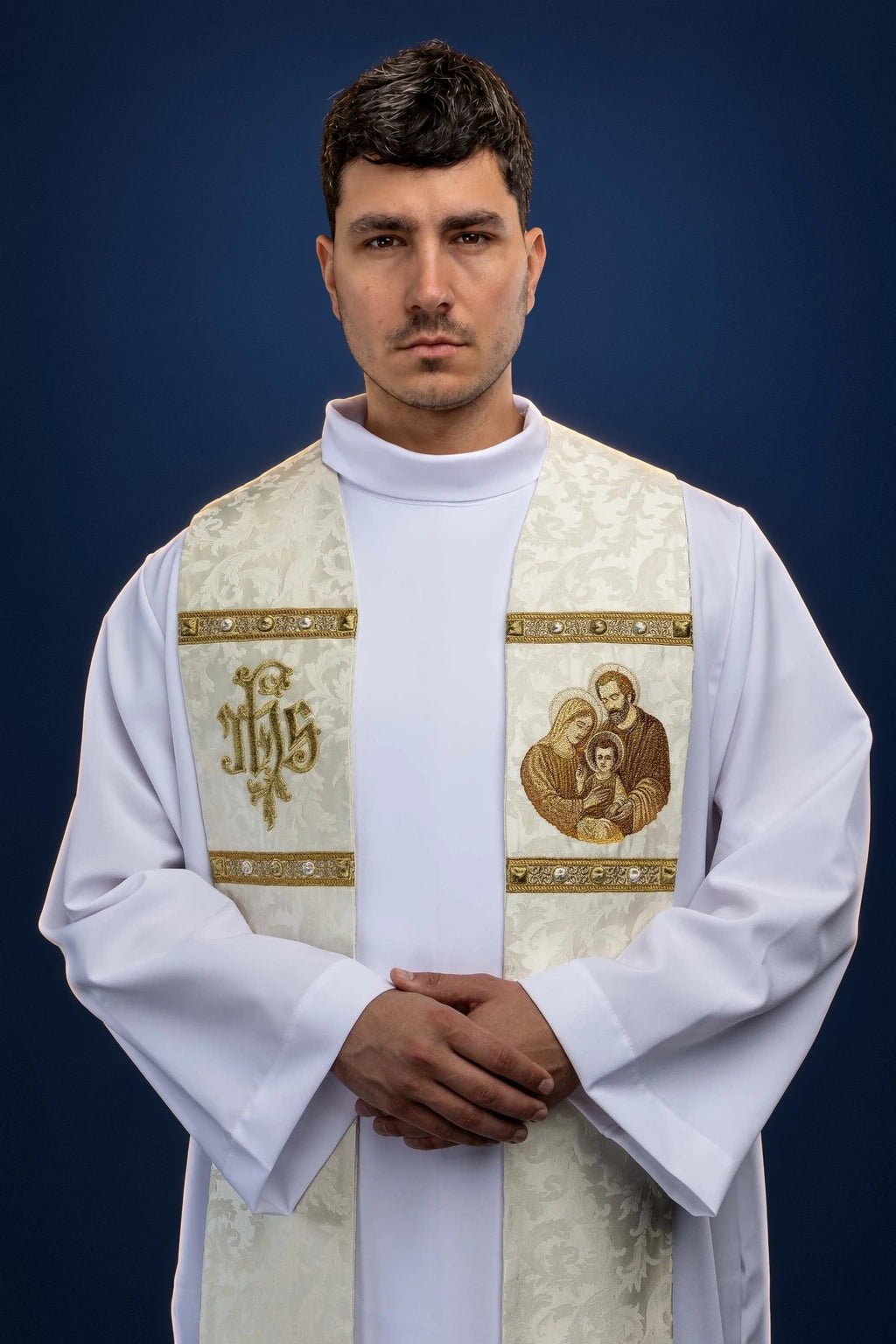 Front view of a cream stole with gold bands, Holy Family image on one side and gold monogram on the other