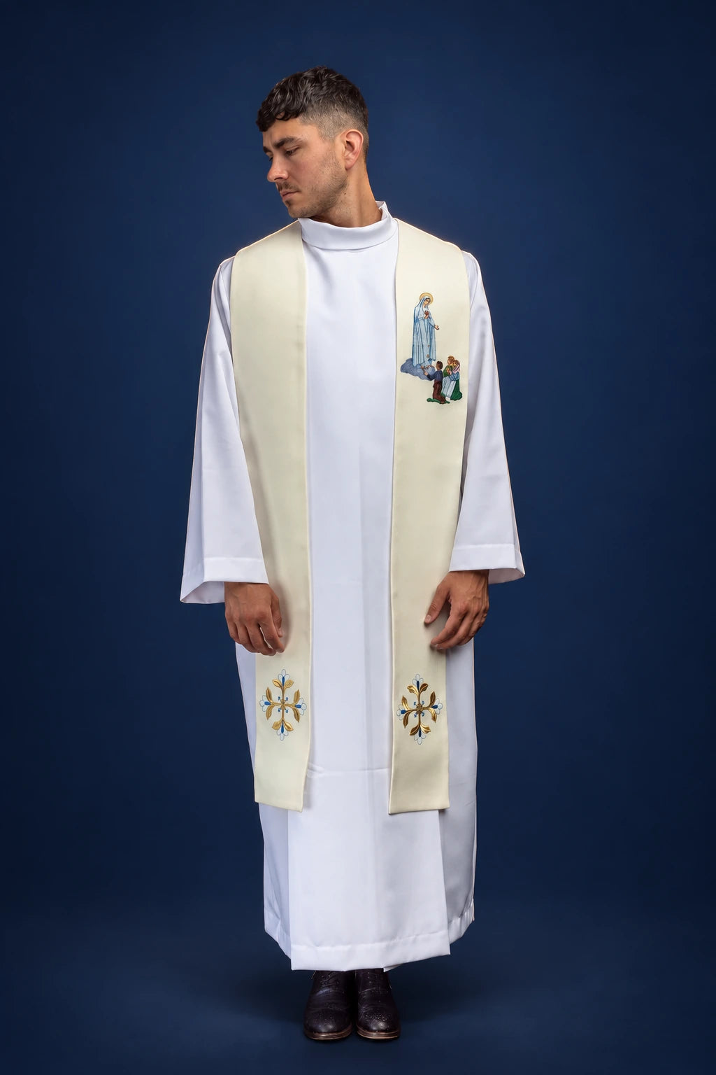 Front view of a cream stole with Our Lady of Fatima embroidery and floral motifs near the ends