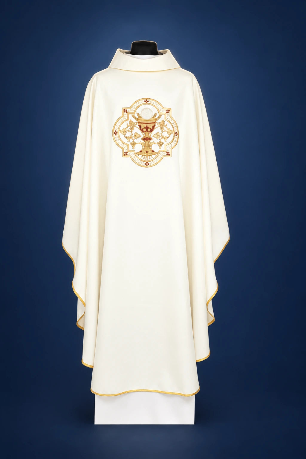 Front view of an ecru chasuble with chalice and IHS embroidery, gold trim