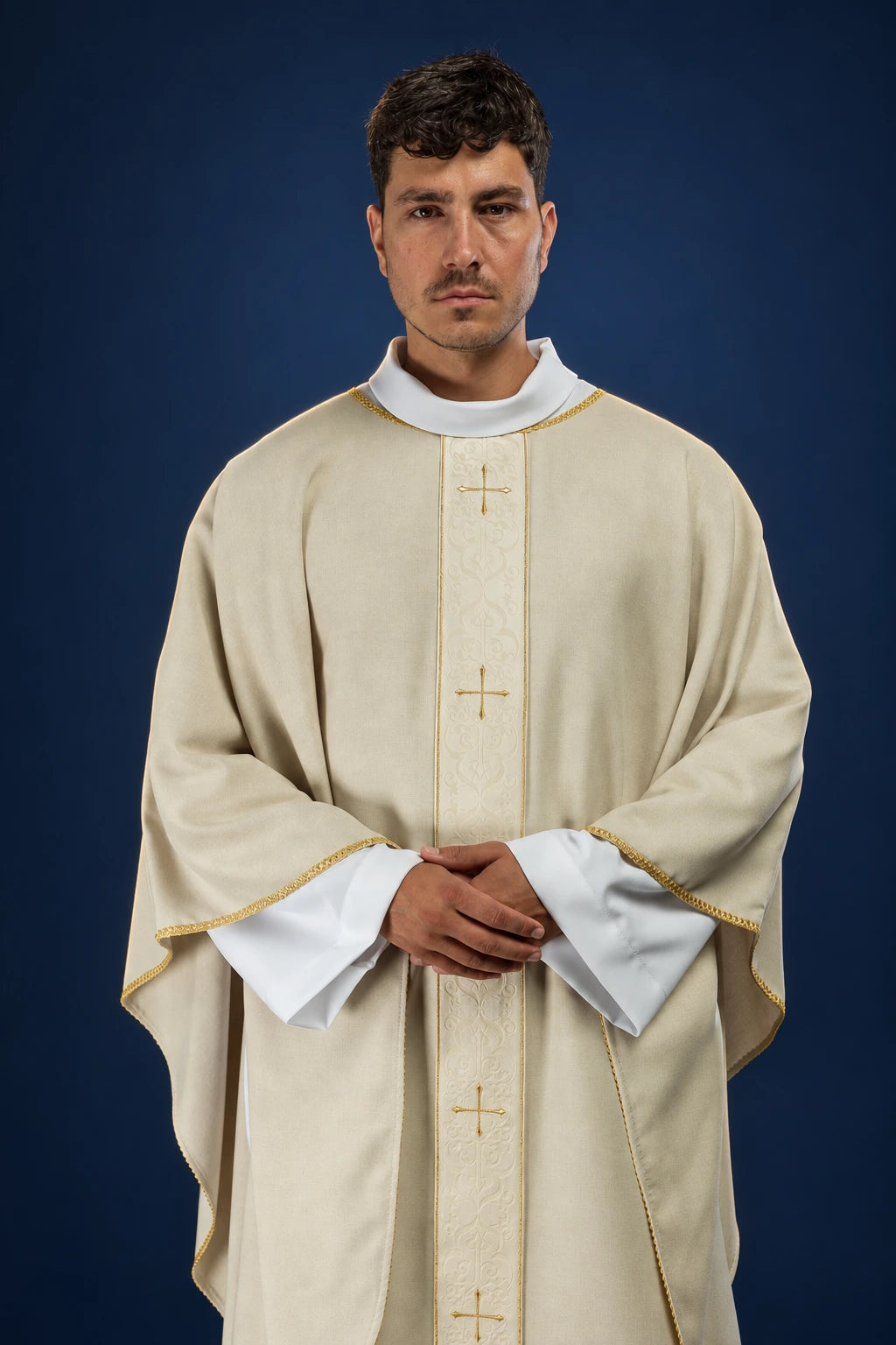 Front view of an ecru chasuble with embroidered vertical orphrey and small crosses