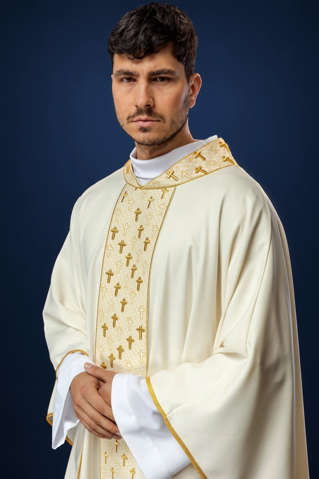 Front view of an ecru chasuble with gold cross-embroidered orphrey and matching collar trim