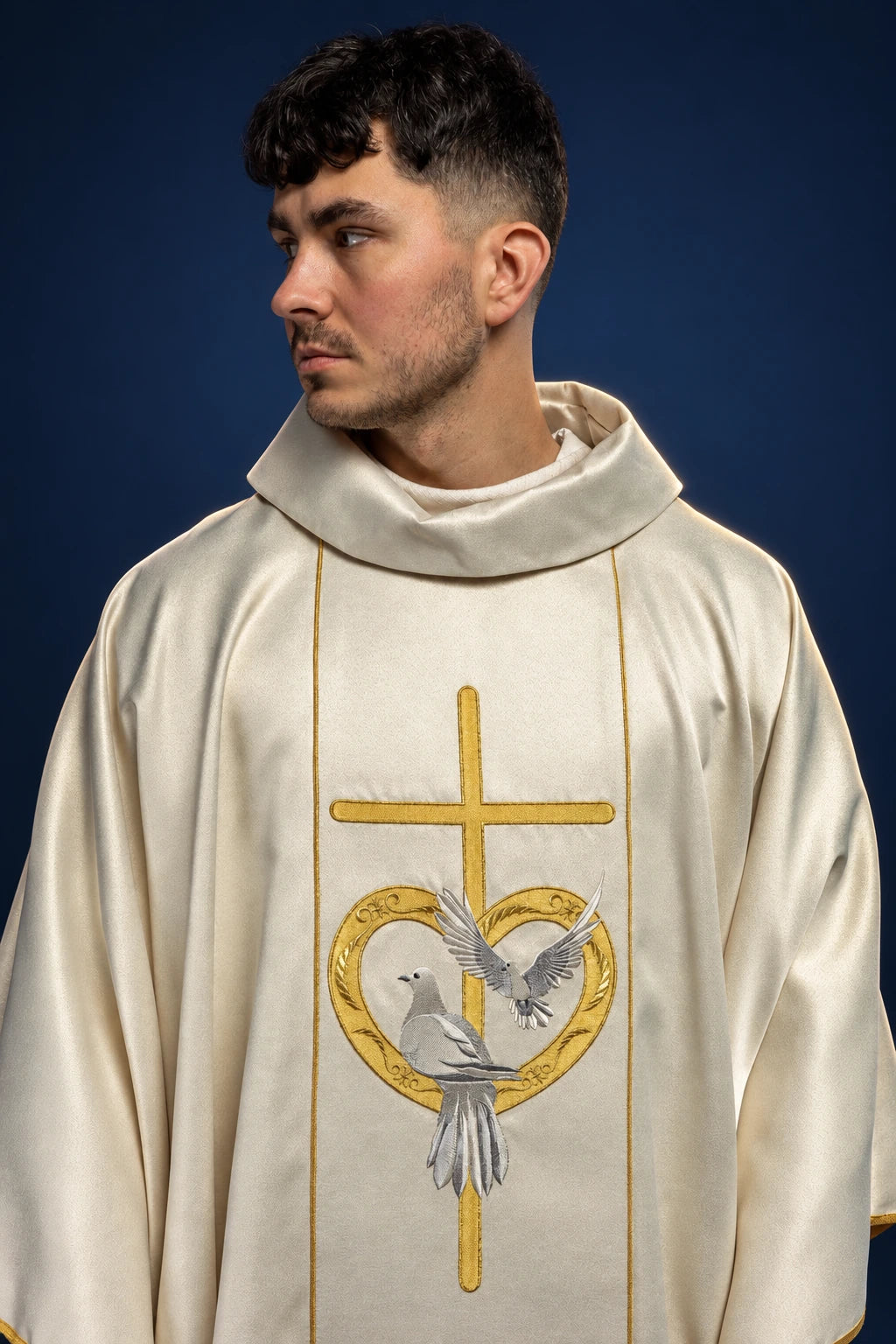 Front view of an ecru chasuble with gold cross and heart, showing doves embroidery on the chest