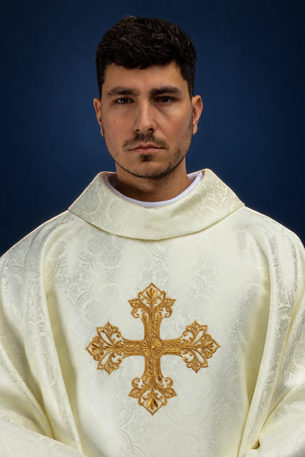 Front view of an ecru chasuble with gold cross motif in jacquard fabric