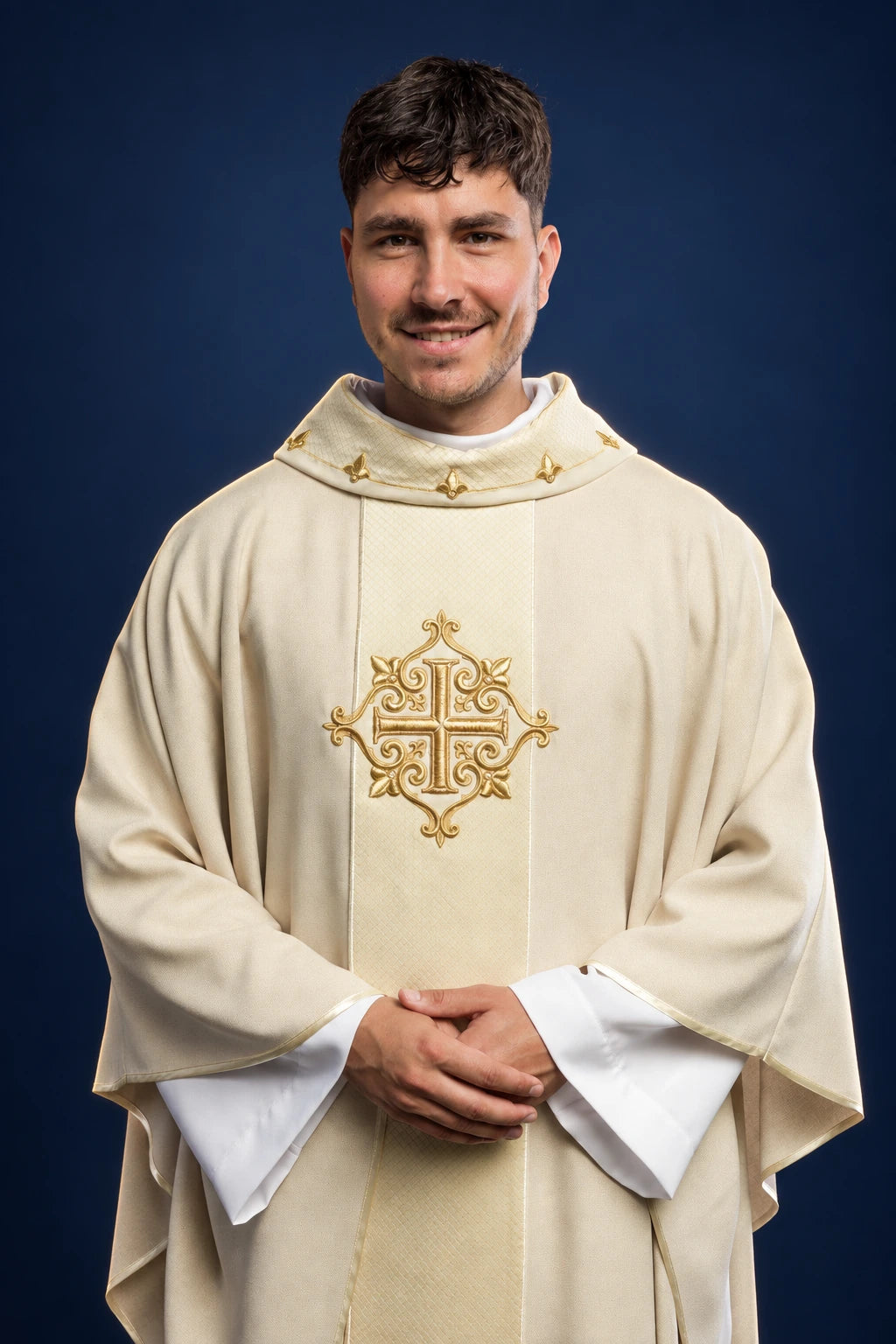 Front view of an ecru chasuble with gold embroidered cross and small collar motifs