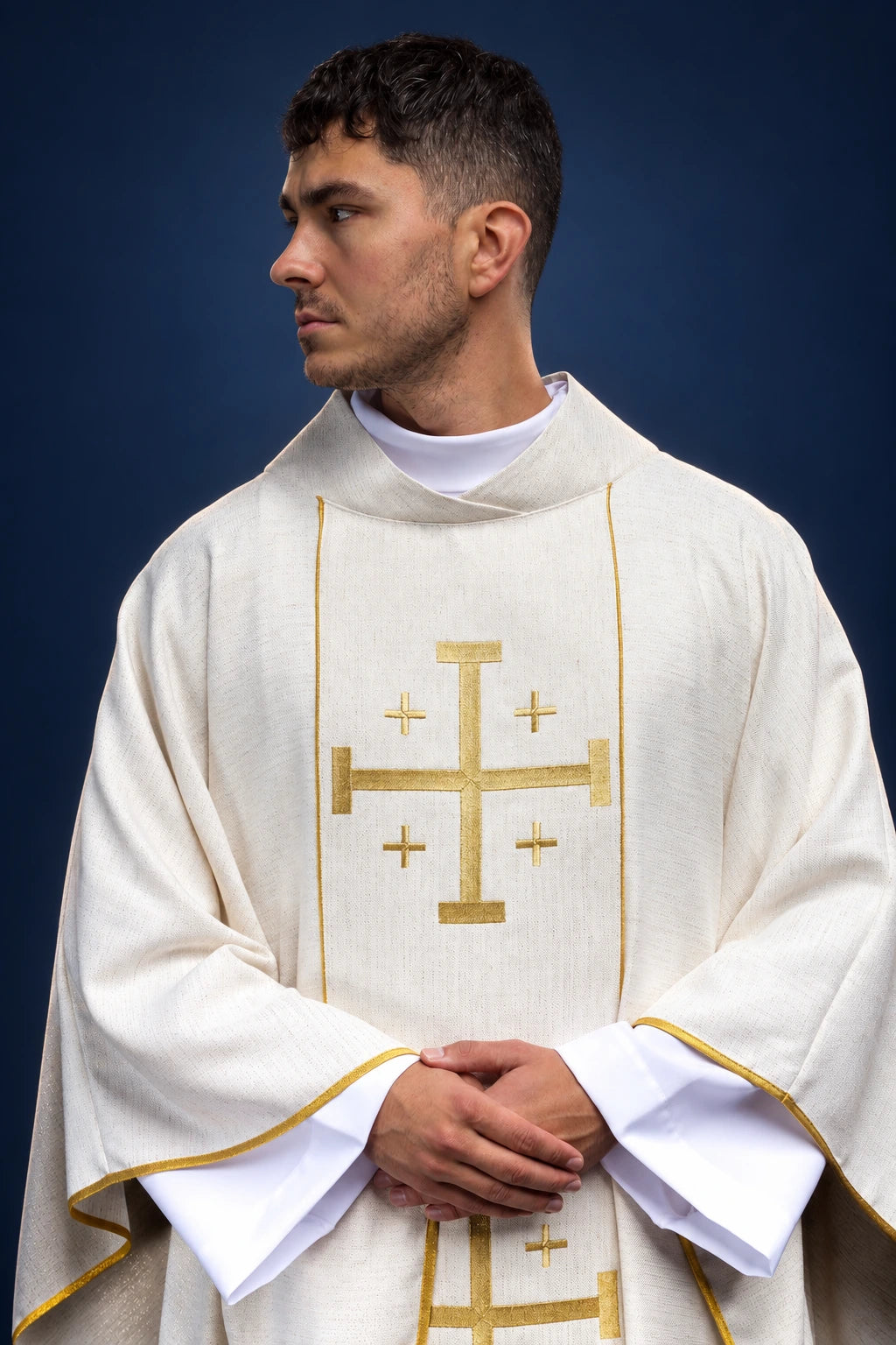Front view of an ecru chasuble with gold Jerusalem cross and matching stole trim