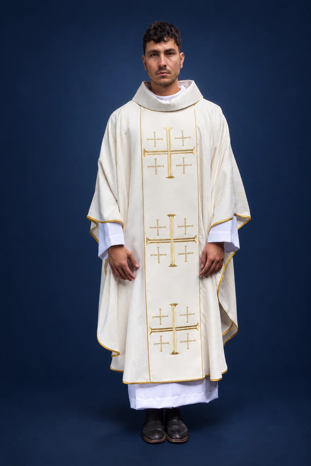 Front view of an ecru chasuble with gold trim and three embroidered Jerusalem cross motifs on the orphrey