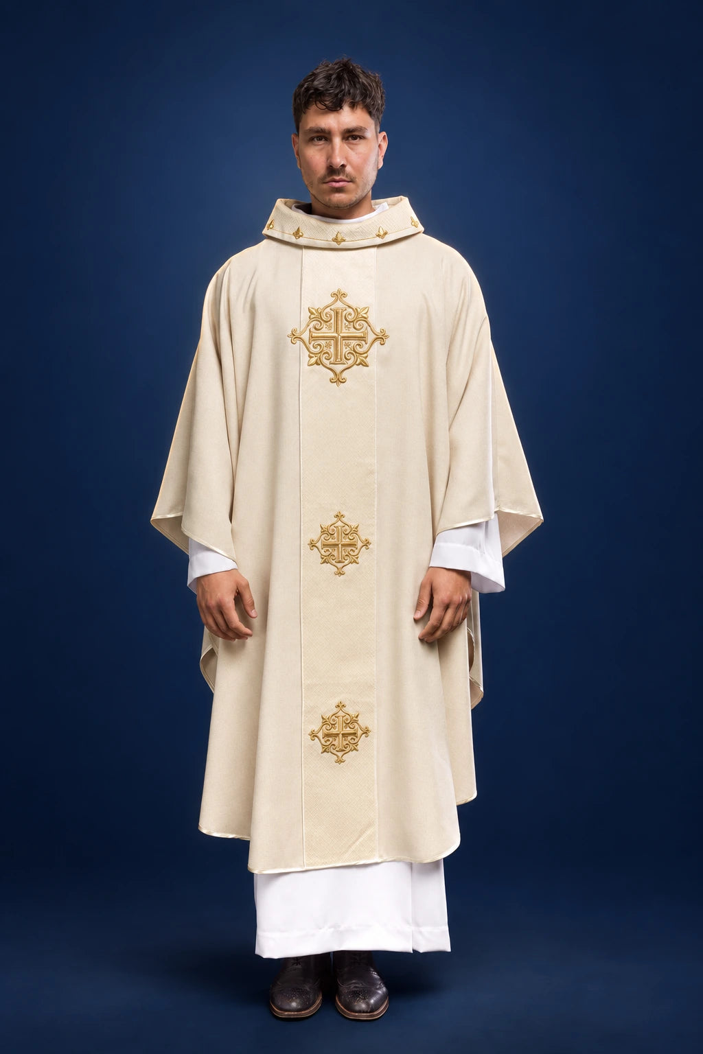 Front view of an ecru chasuble with velvet orphrey and gold cross embroidery