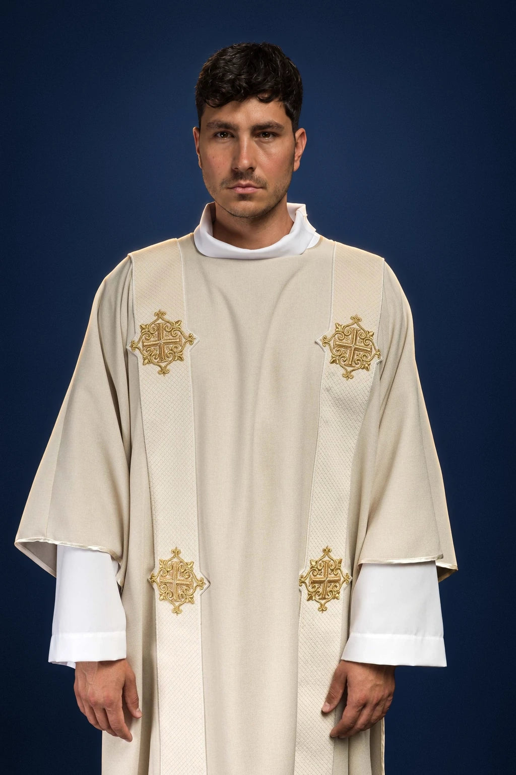 Front view of ecru dalmatic with vertical orphreys and gold cross motifs