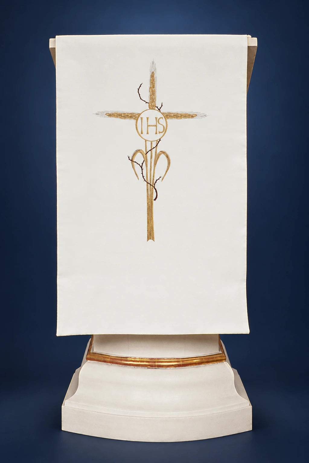 Front view of an ecru lectern cover with embroidered cross, IHS, and vine motif
