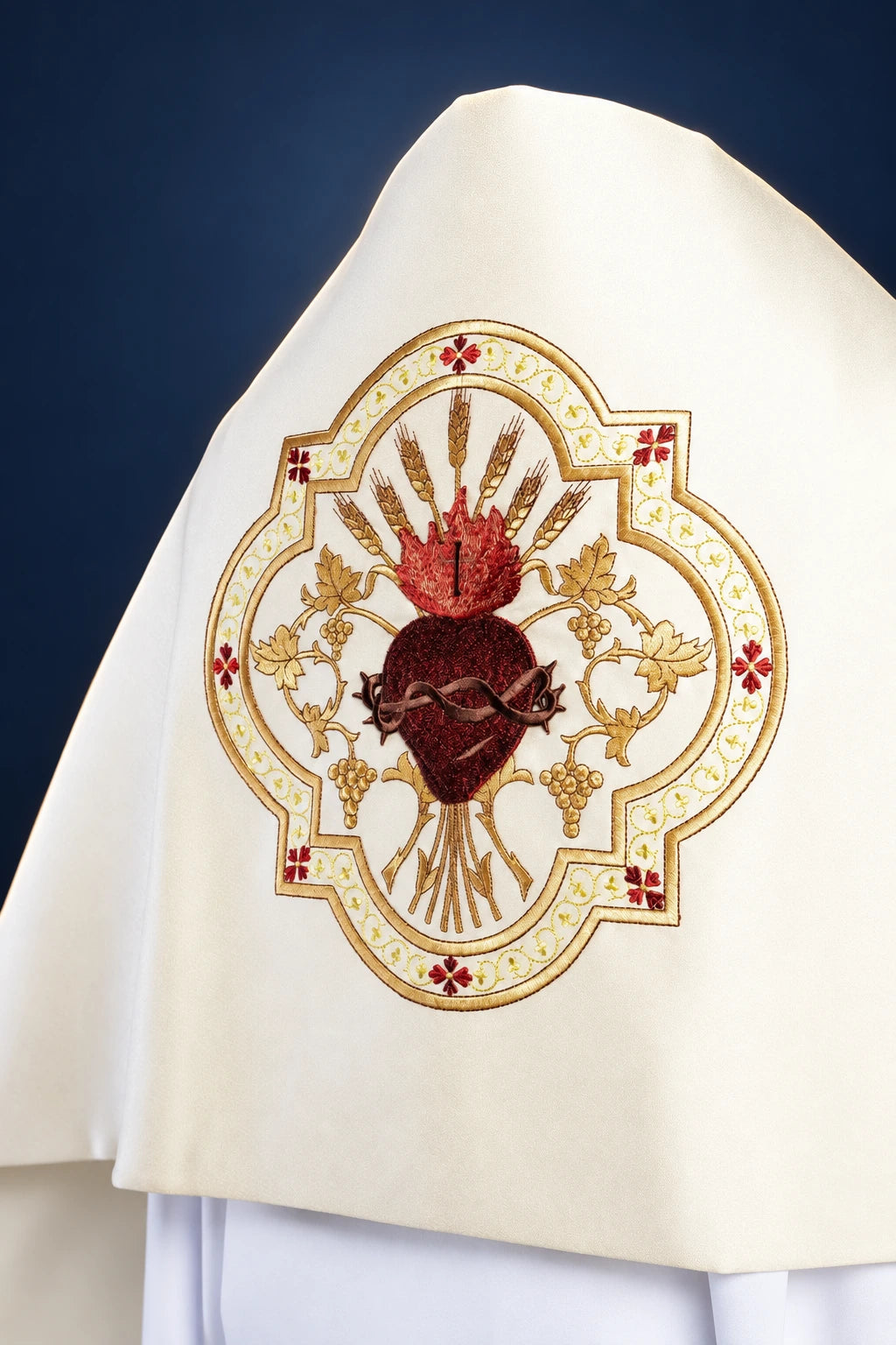 Front view of an ecru liturgical veil with Sacred Heart embroidery centered on the fabric.