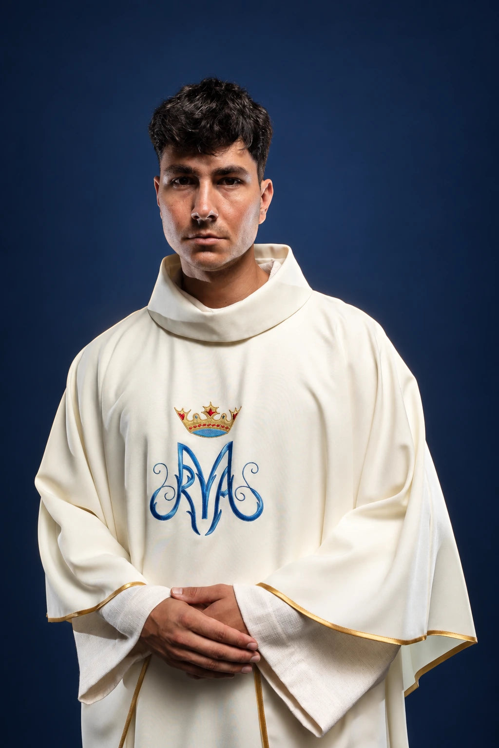 Front view of ecru Marian chasuble with embroidered crowned Marian monogram and gold trim on the sleeves and hem