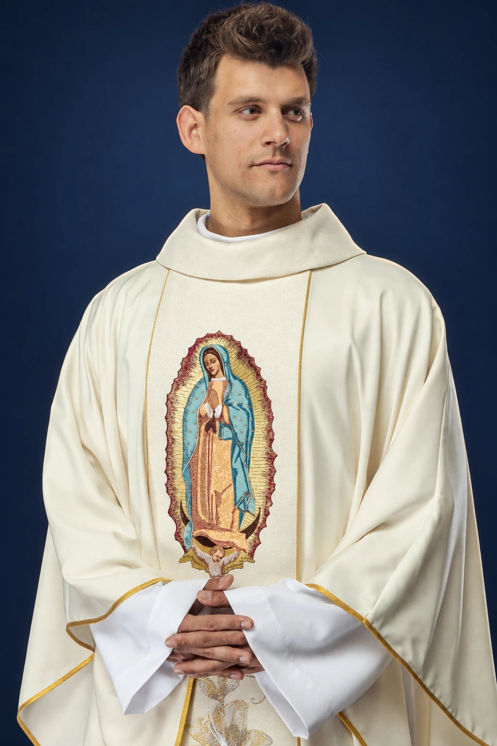 Front view of a gold chasuble with embroidered Our Lady of Guadalupe on the orphrey