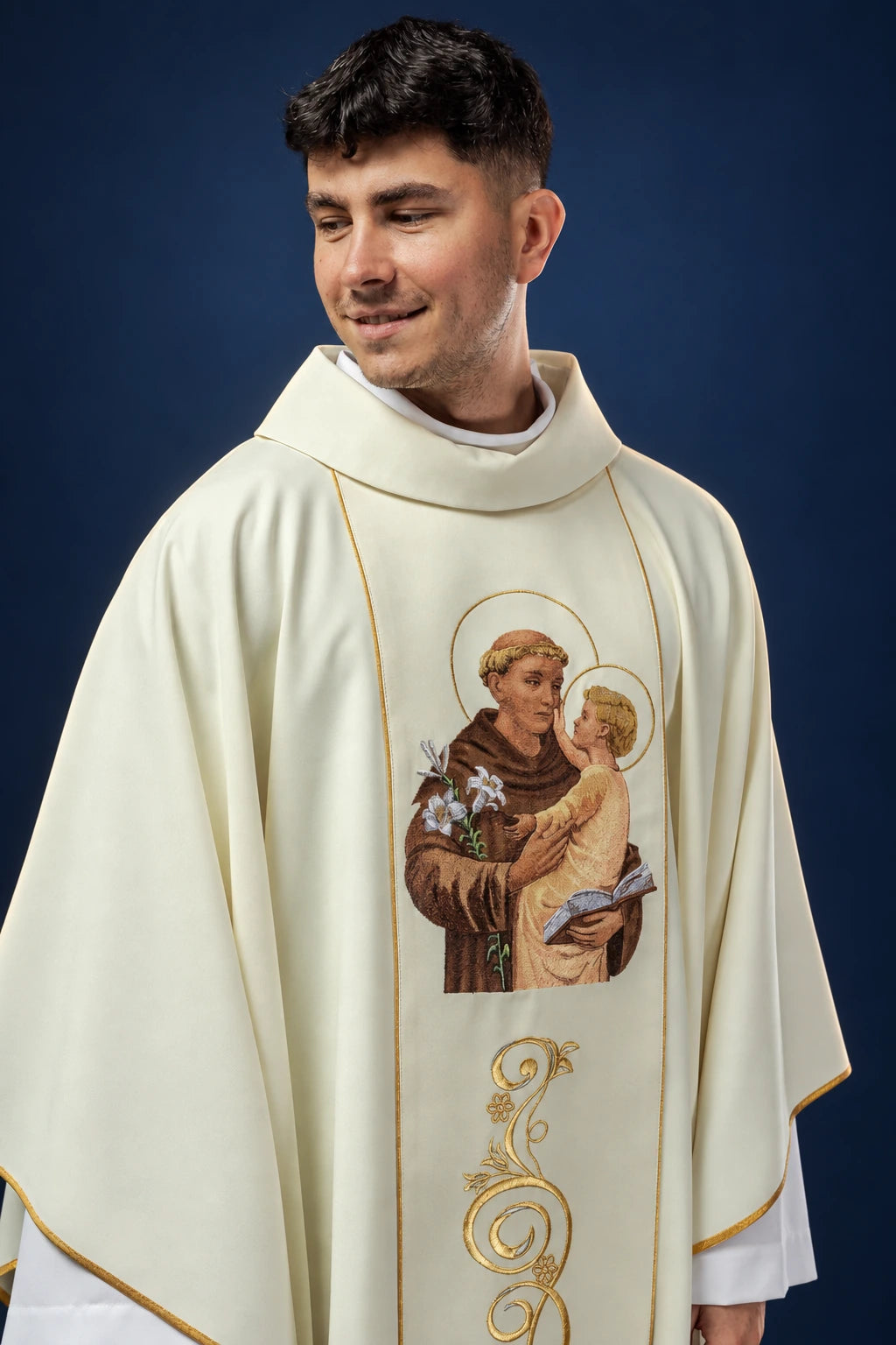Front view of a gold chasuble with embroidered Saint Anthony and Child motif and gold trim