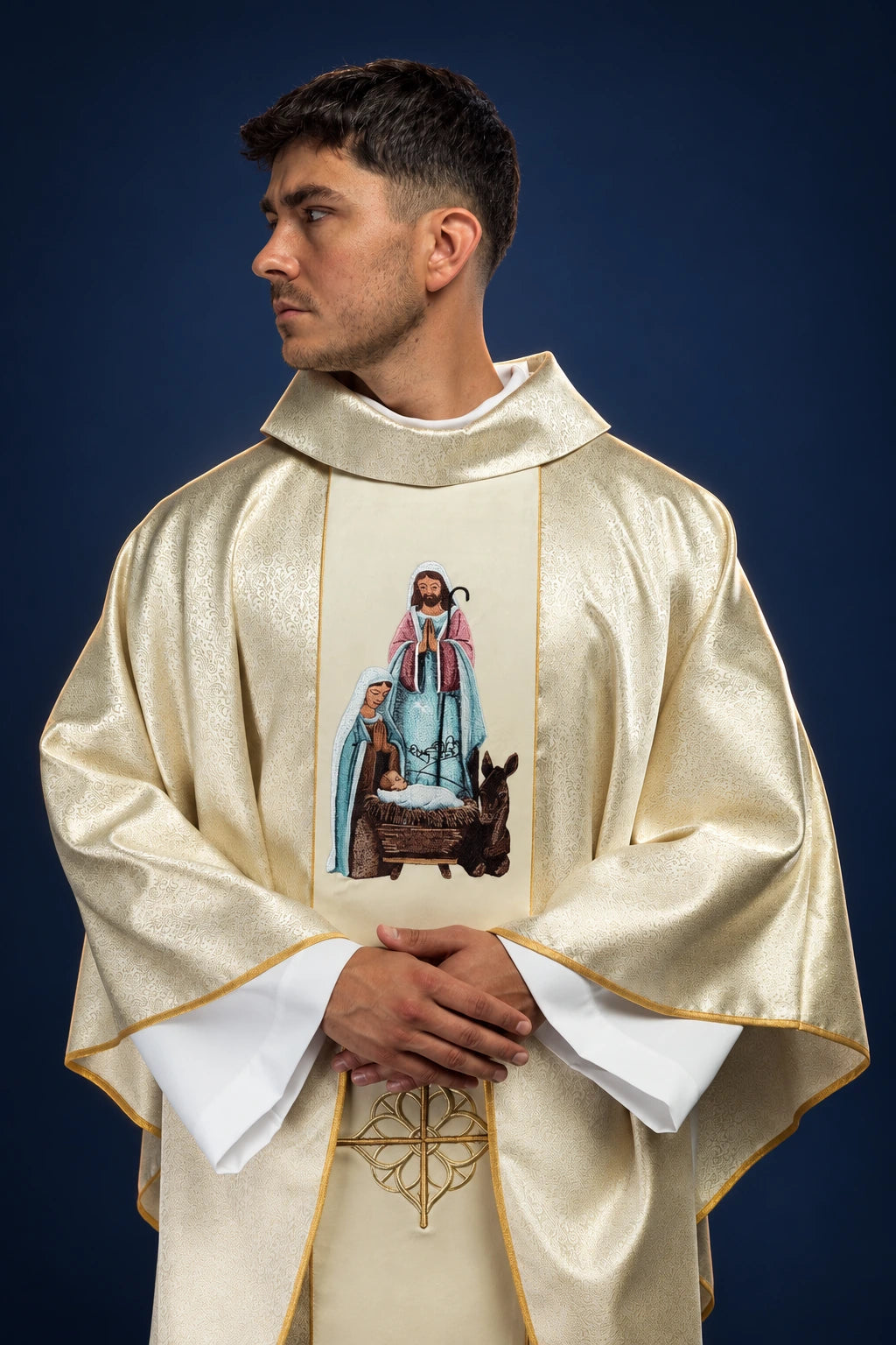 Front view of a gold chasuble with Holy Family embroidery and gold-trimmed collar and hem