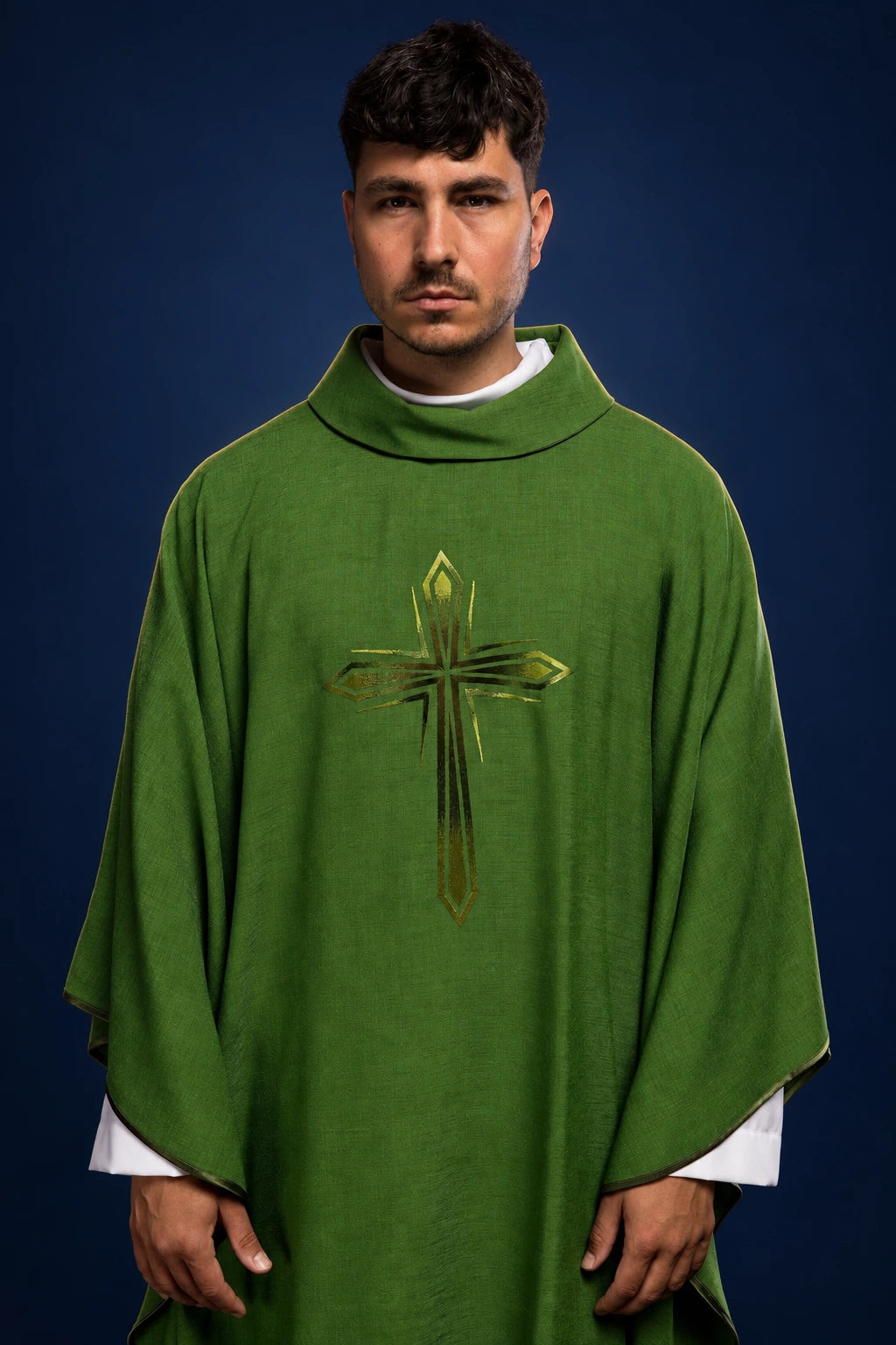 Front view of a green chasuble with a central embroidered cross and gold accents
