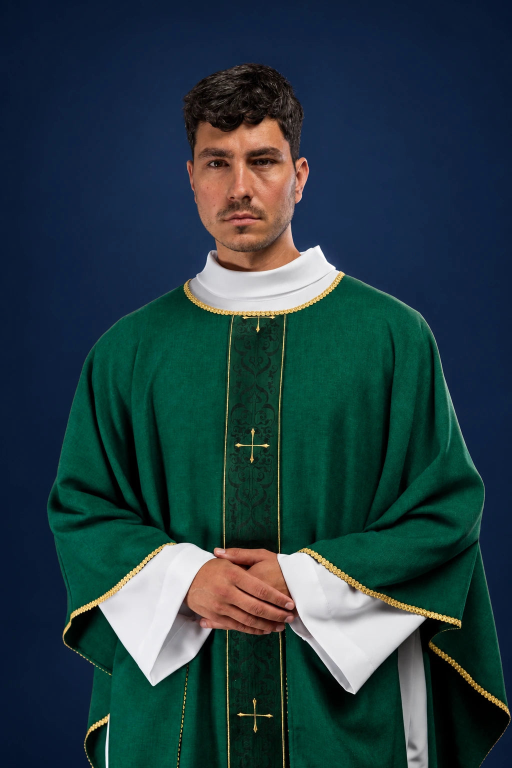 Front view of a green chasuble with embroidered vertical orphrey and gold crosses