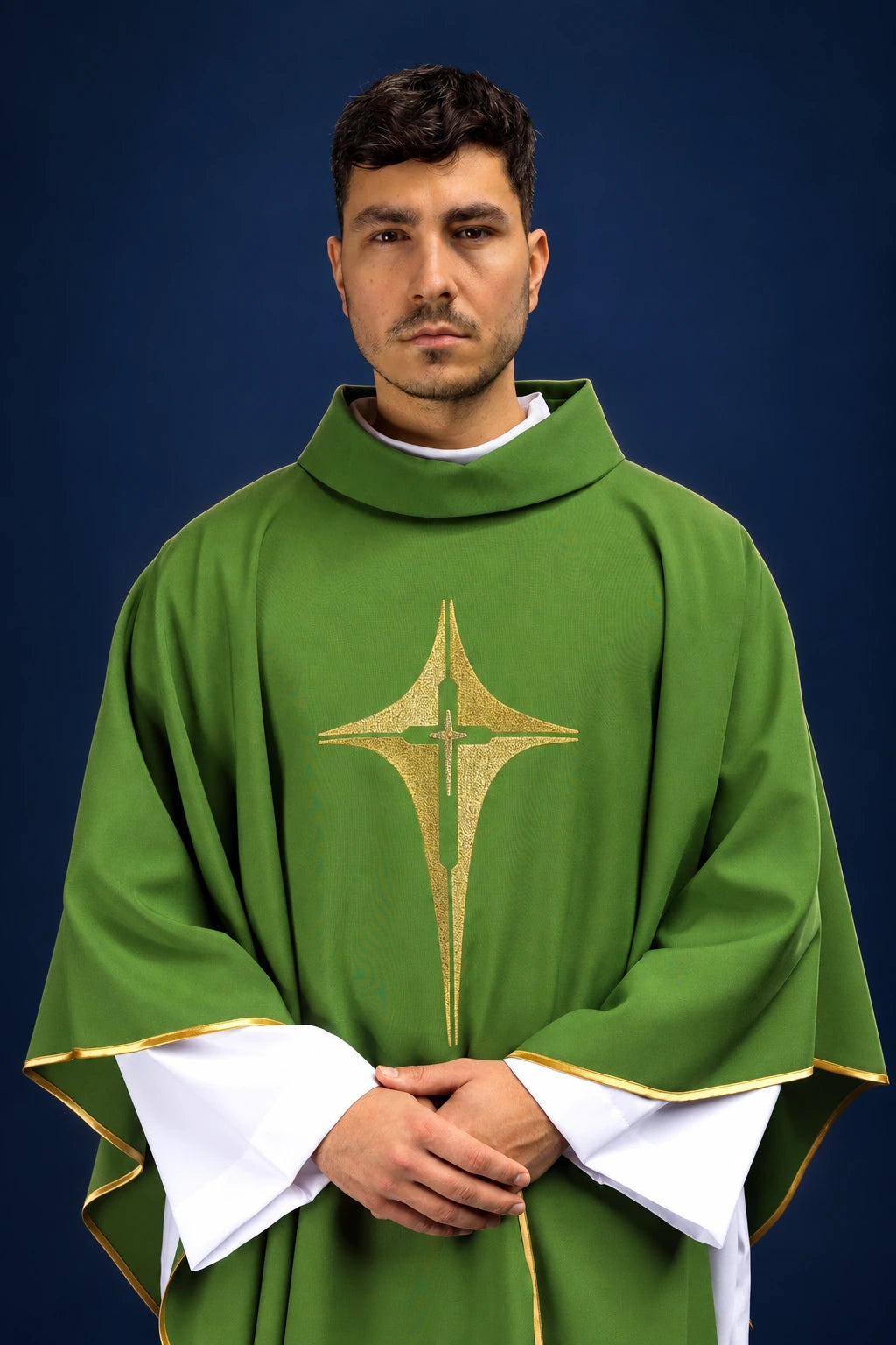 Front view of a green chasuble with gold cross-and-star embroidery and gold trim on the sleeves and hem