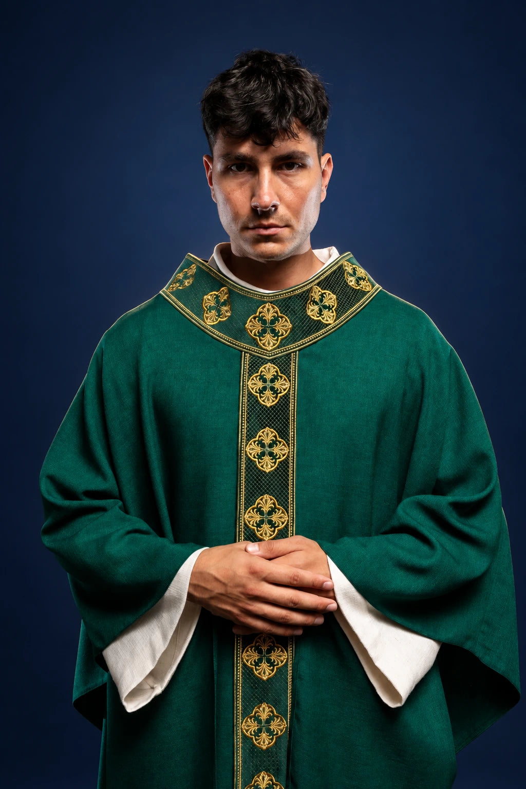 Front view of green chasuble with gold embroidered orphrey and cross-embroidered collar