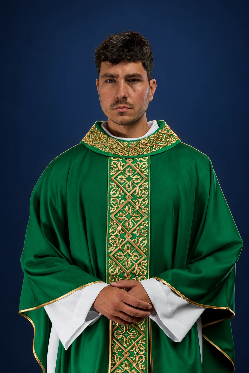 Front view of a green chasuble with gold floral embroidery and cross motifs on the vertical orphrey and collar.