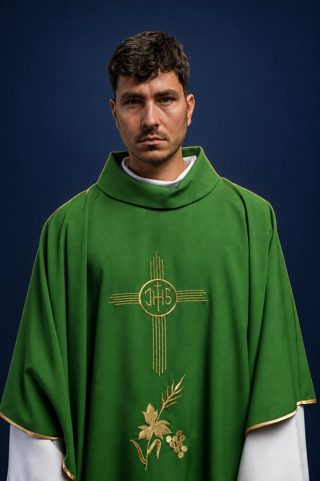 Front view of a green chasuble with gold IHS cross embroidery and vine motif on the chest