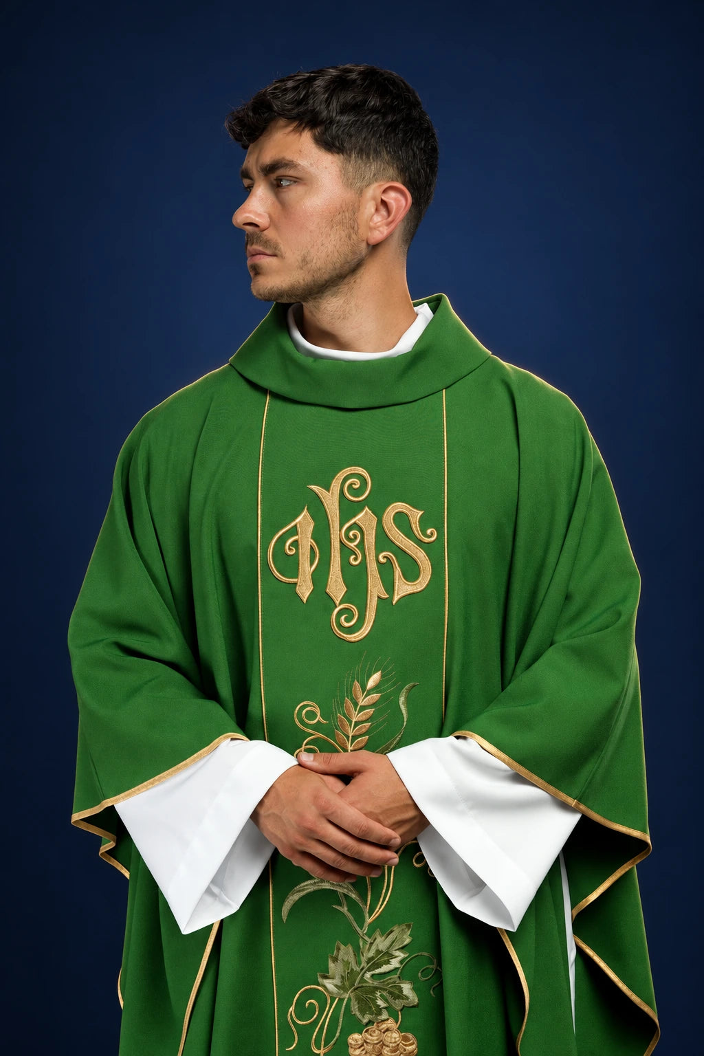 Front view of green chasuble with gold IHS, wheat, and grape embroidery on the orphrey