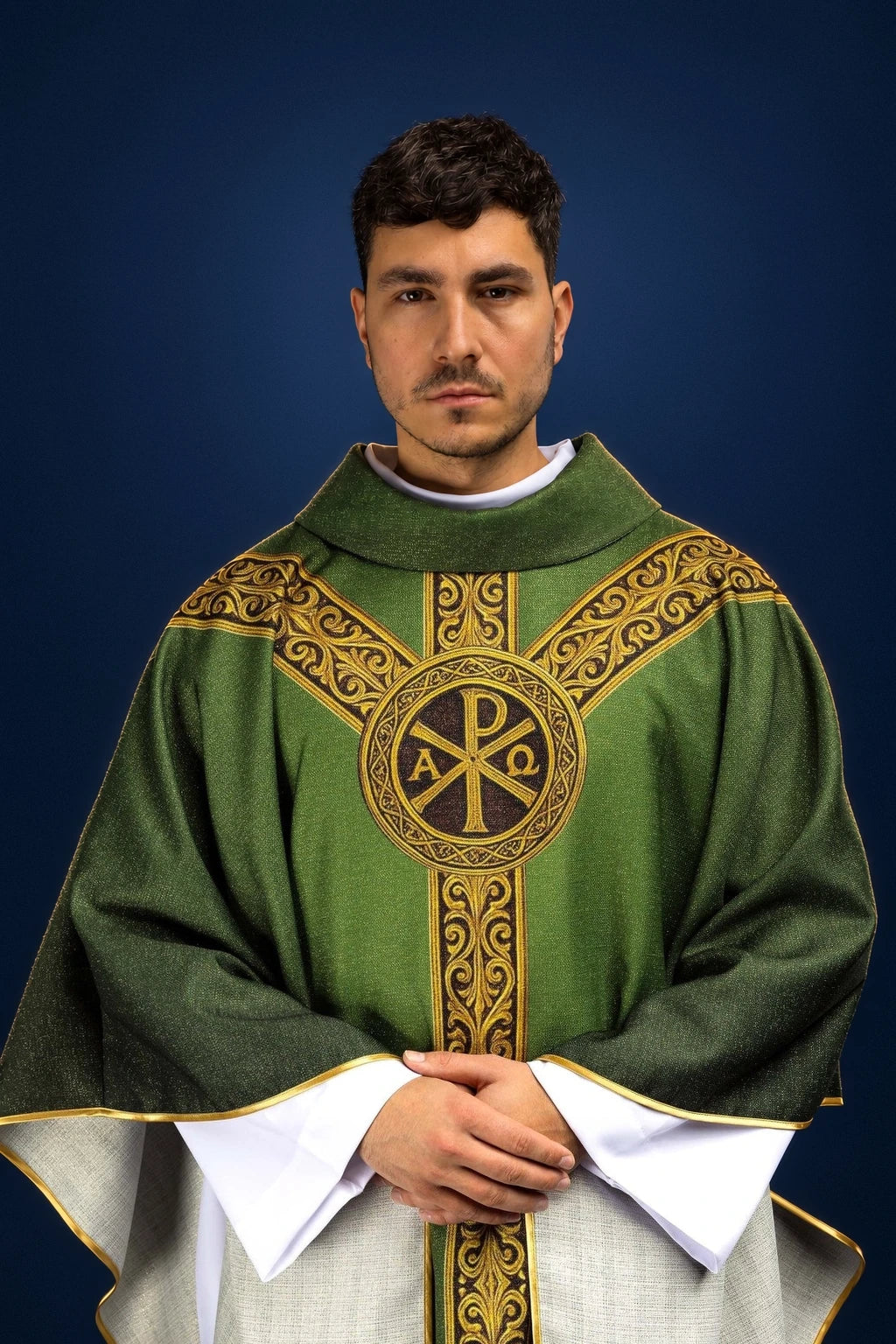 Front view of green chasuble with gold ornamental bands and central Pax emblem