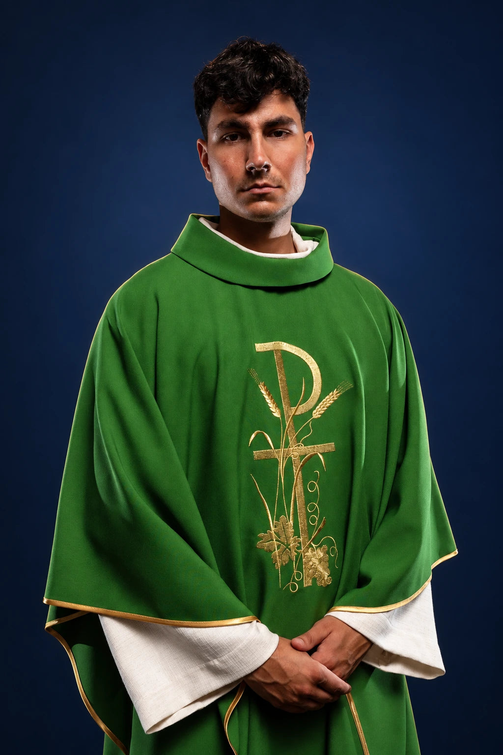 Front view of a green chasuble with gold Pax embroidery and gold-edged trim