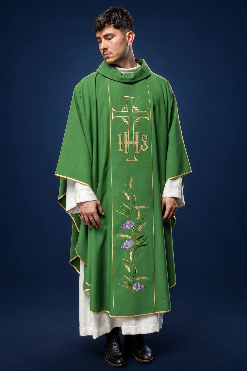 Front view of a green chasuble with gold trim, IHS cross and wheat embroidery on the front panel
