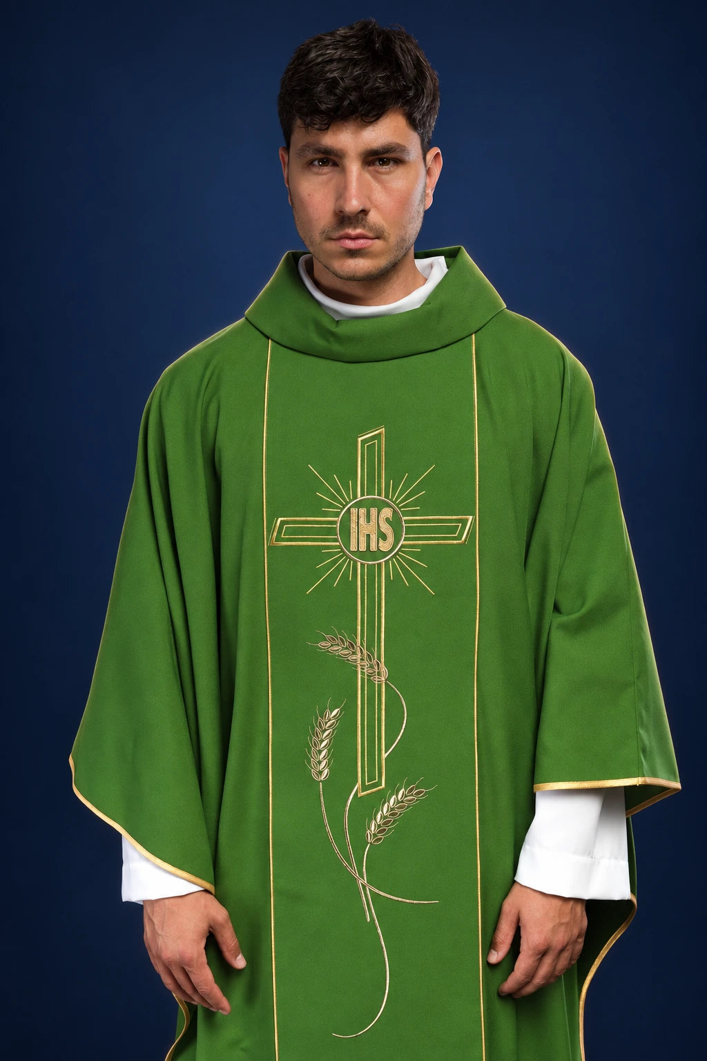 Front view of a green chasuble with wide gold orphrey and IHS cross embroidery