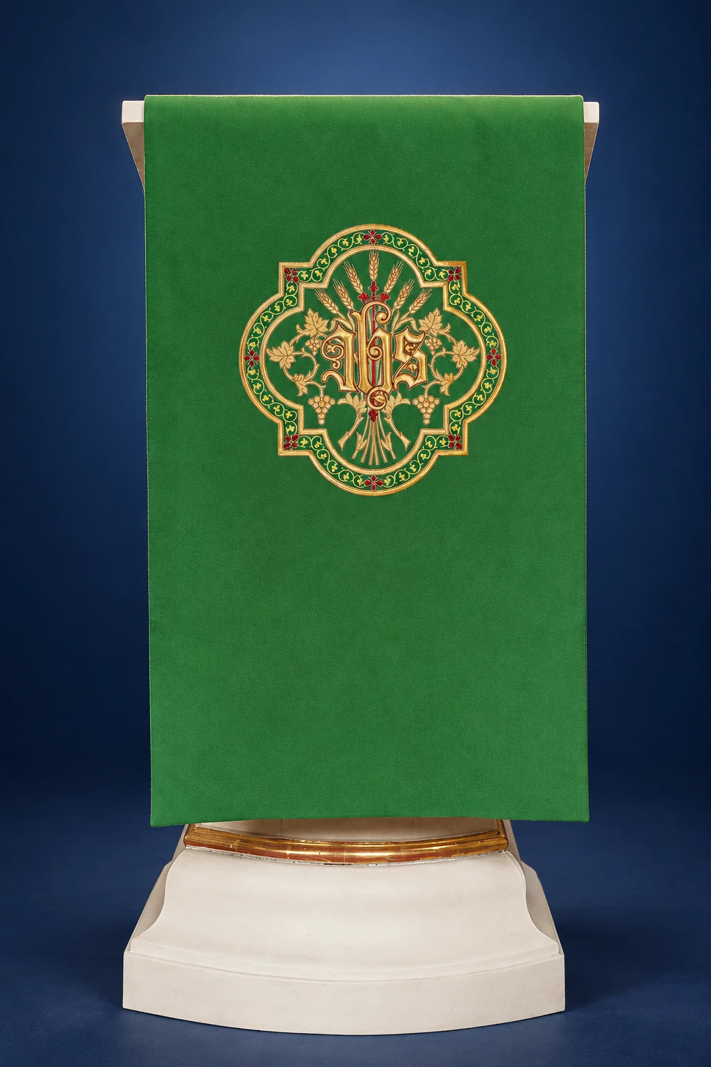 Front view of a green church lectern cover with gold JHS embroidery and ornate floral border