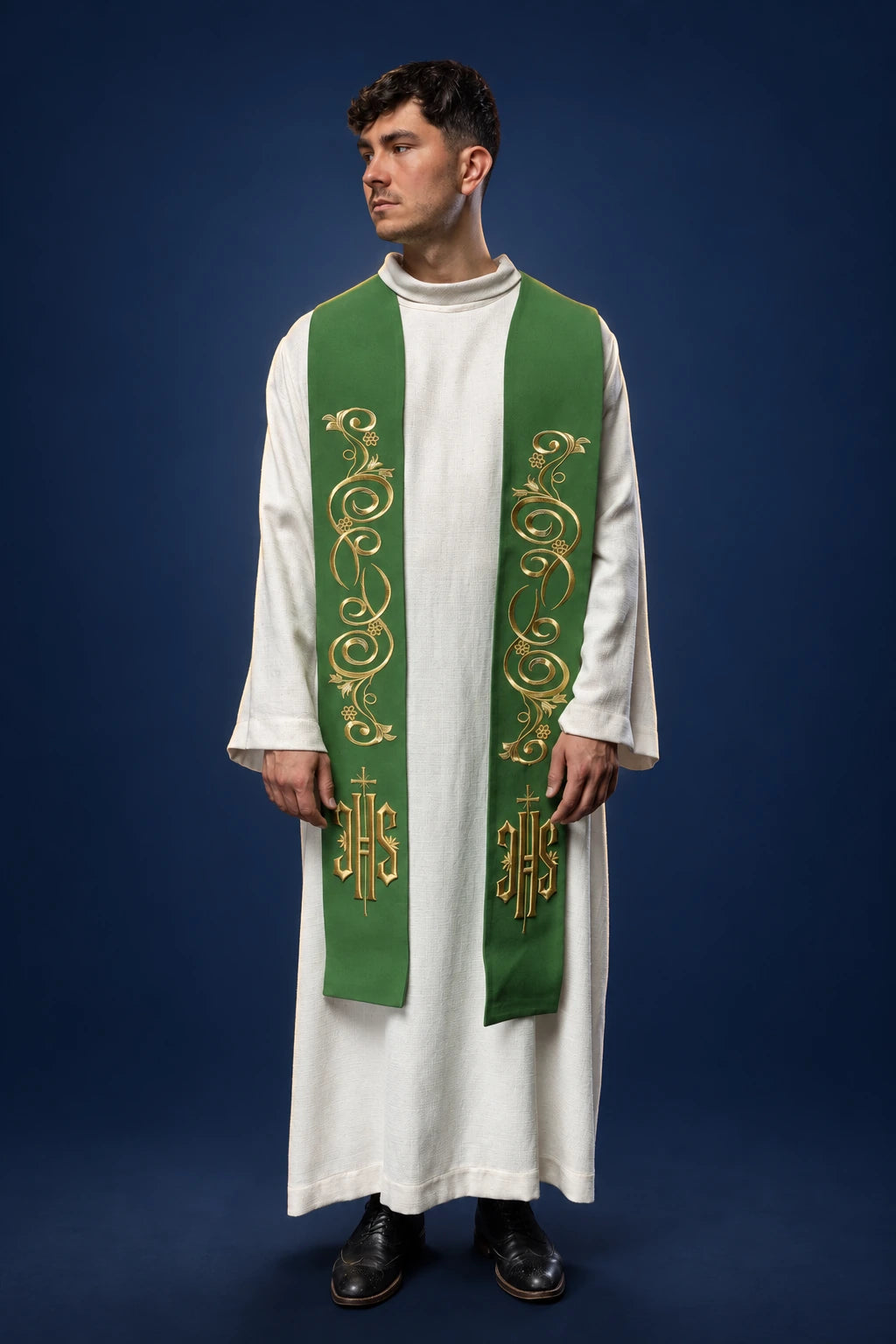 Front view of a green priest stole with gold vine embroidery and IHS symbols near the ends