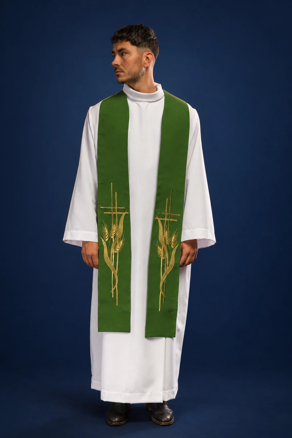 Front view of a green priest stole with gold wheat embroidery over a white alb