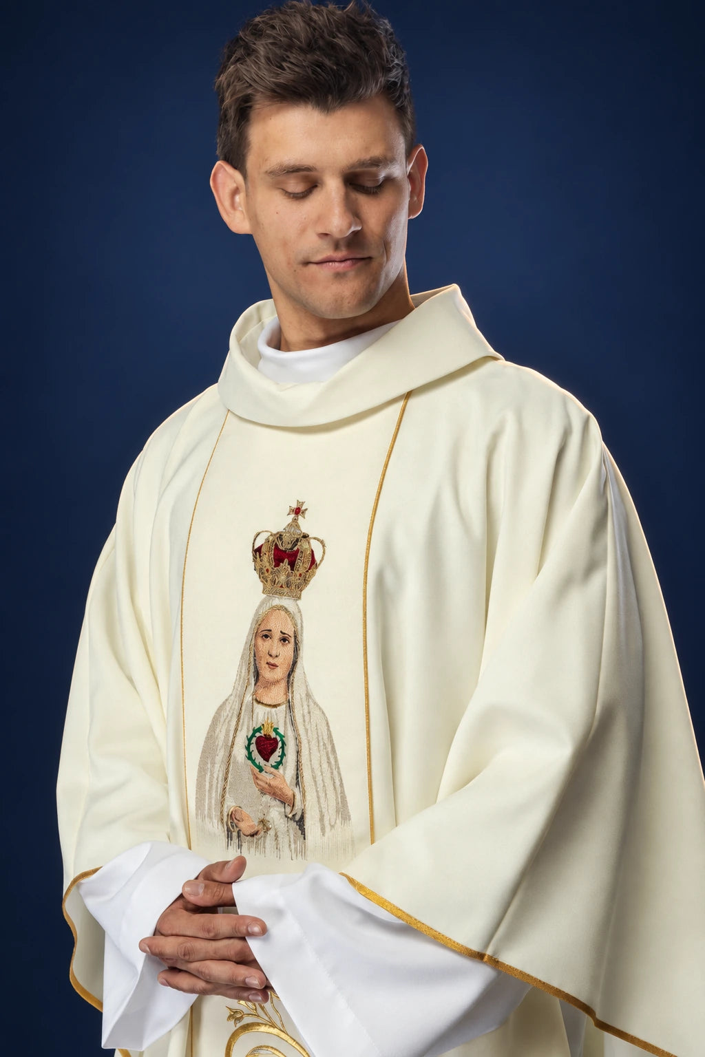 Front view of an ivory chasuble with embroidered Our Lady of Fátima on the chest