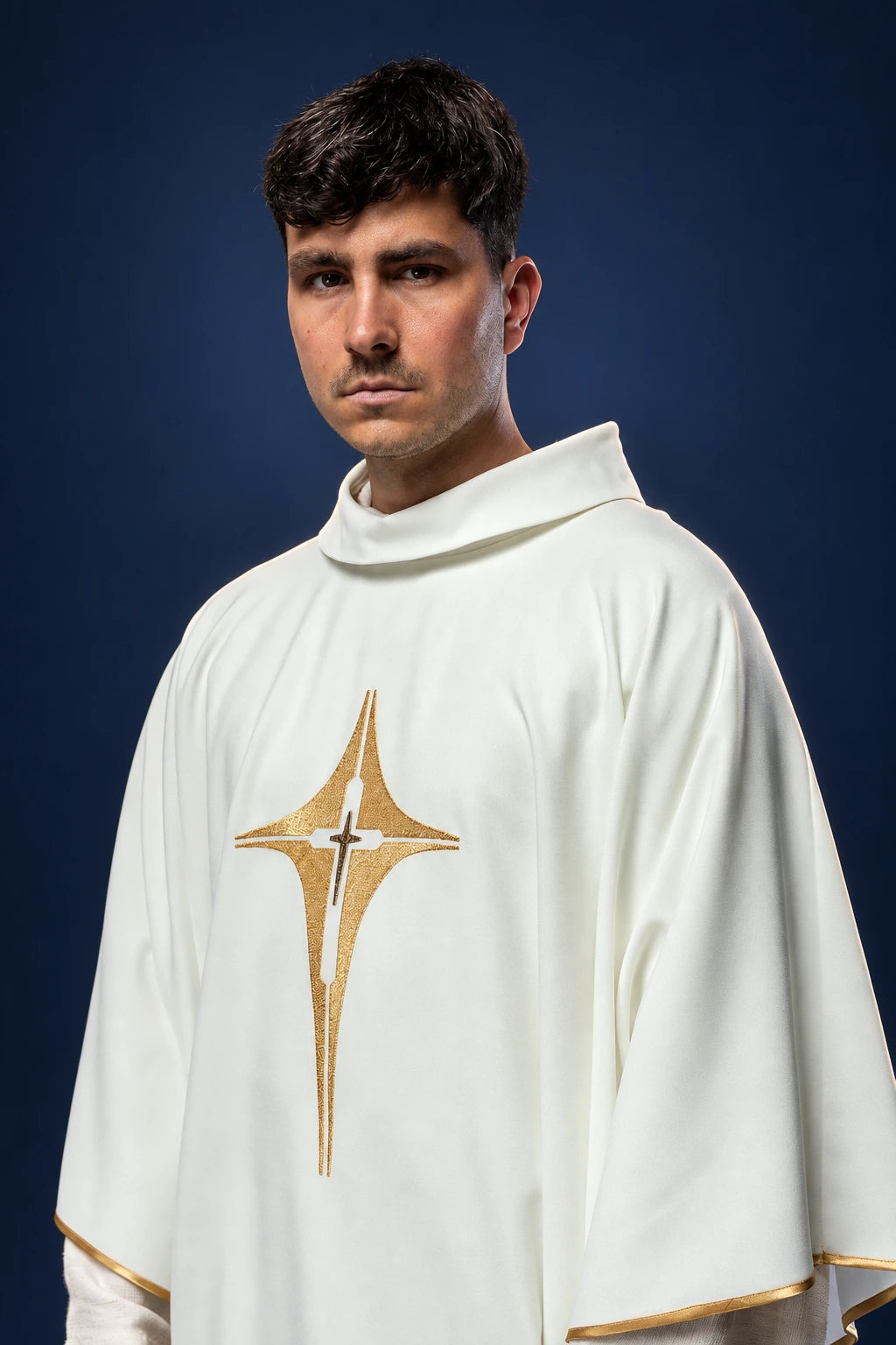 Front view of an ivory chasuble with a gold cross embroidery on the chest and gold trim at the sleeves and hem