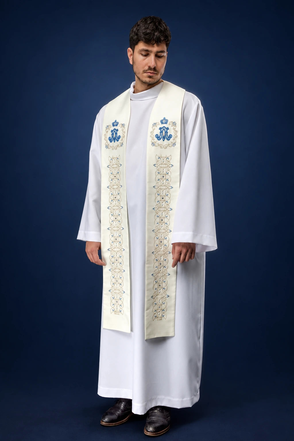 Front view of an ivory Marian stole with blue Marian monograms and floral embroidery