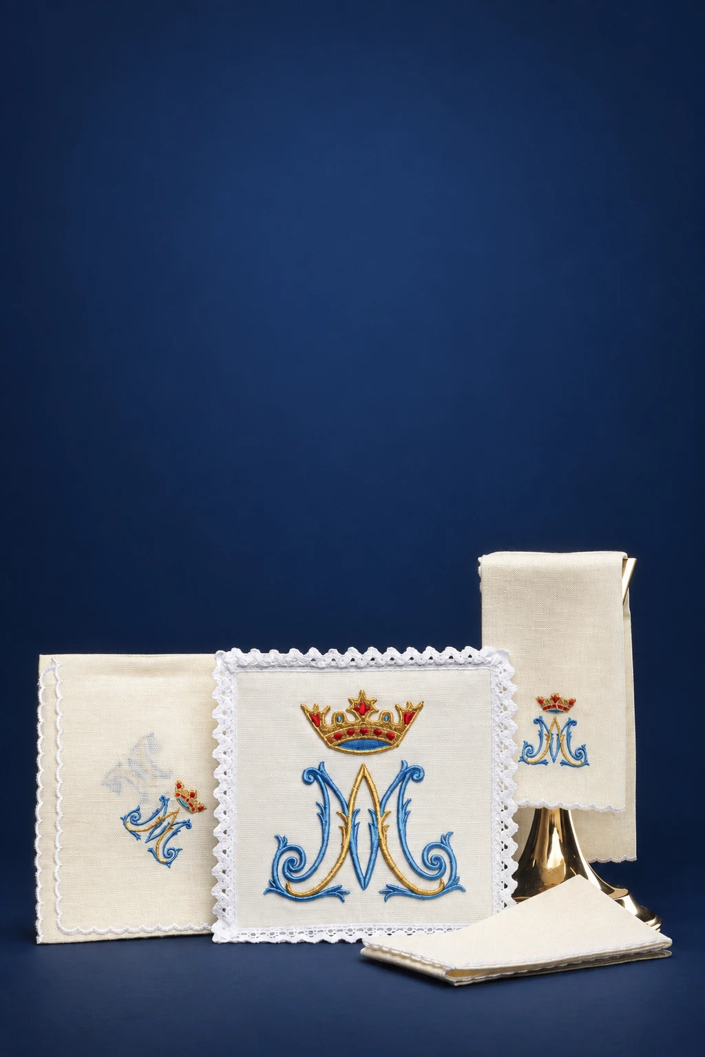 Front view of linen altar cloths and purificators with Marian embroidery and crown motif