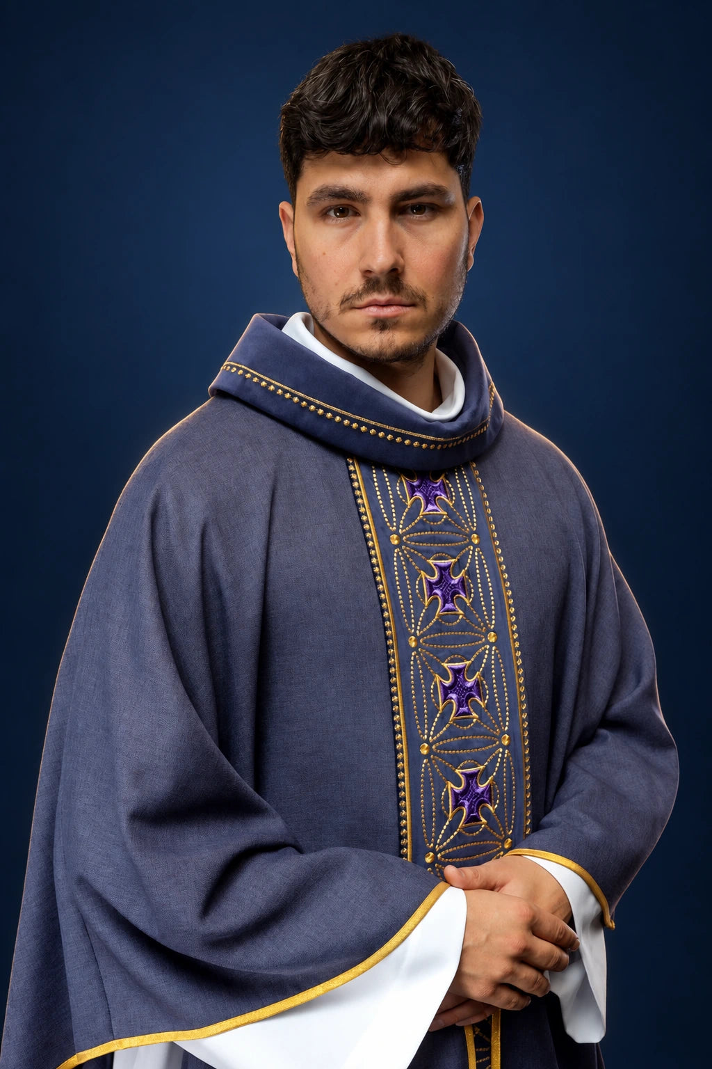 Front view of a purple chasuble with embroidered crosses and vine orphrey, edged in gold trim