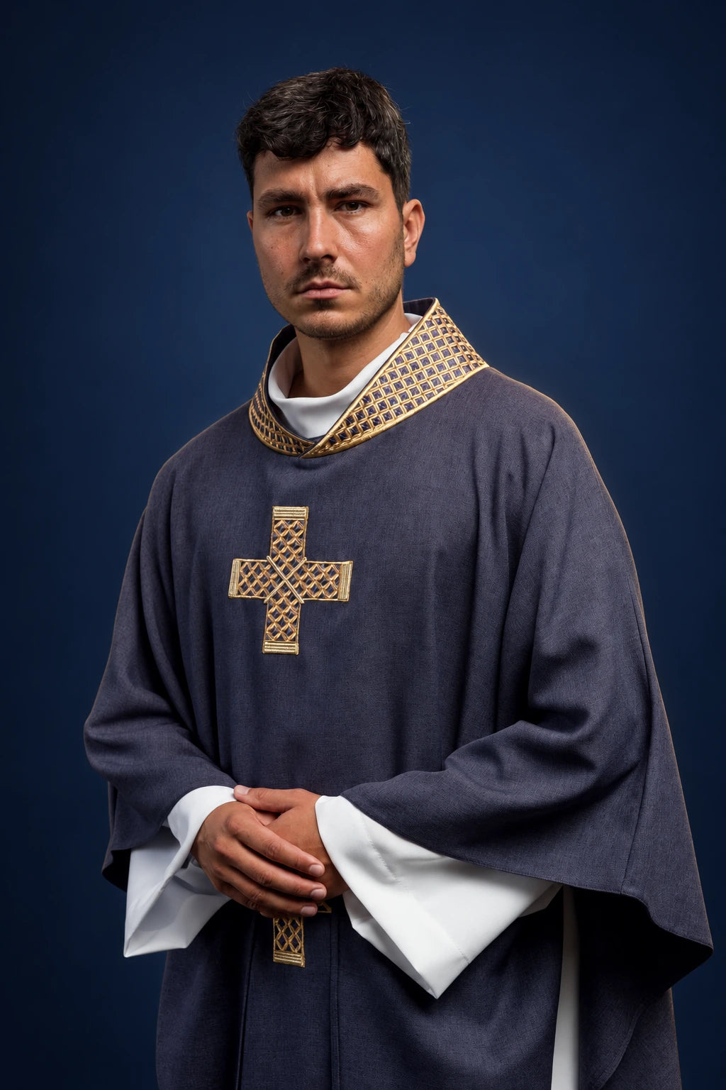 Front view of a purple chasuble with gold cross on the chest and embroidered gold collar trim