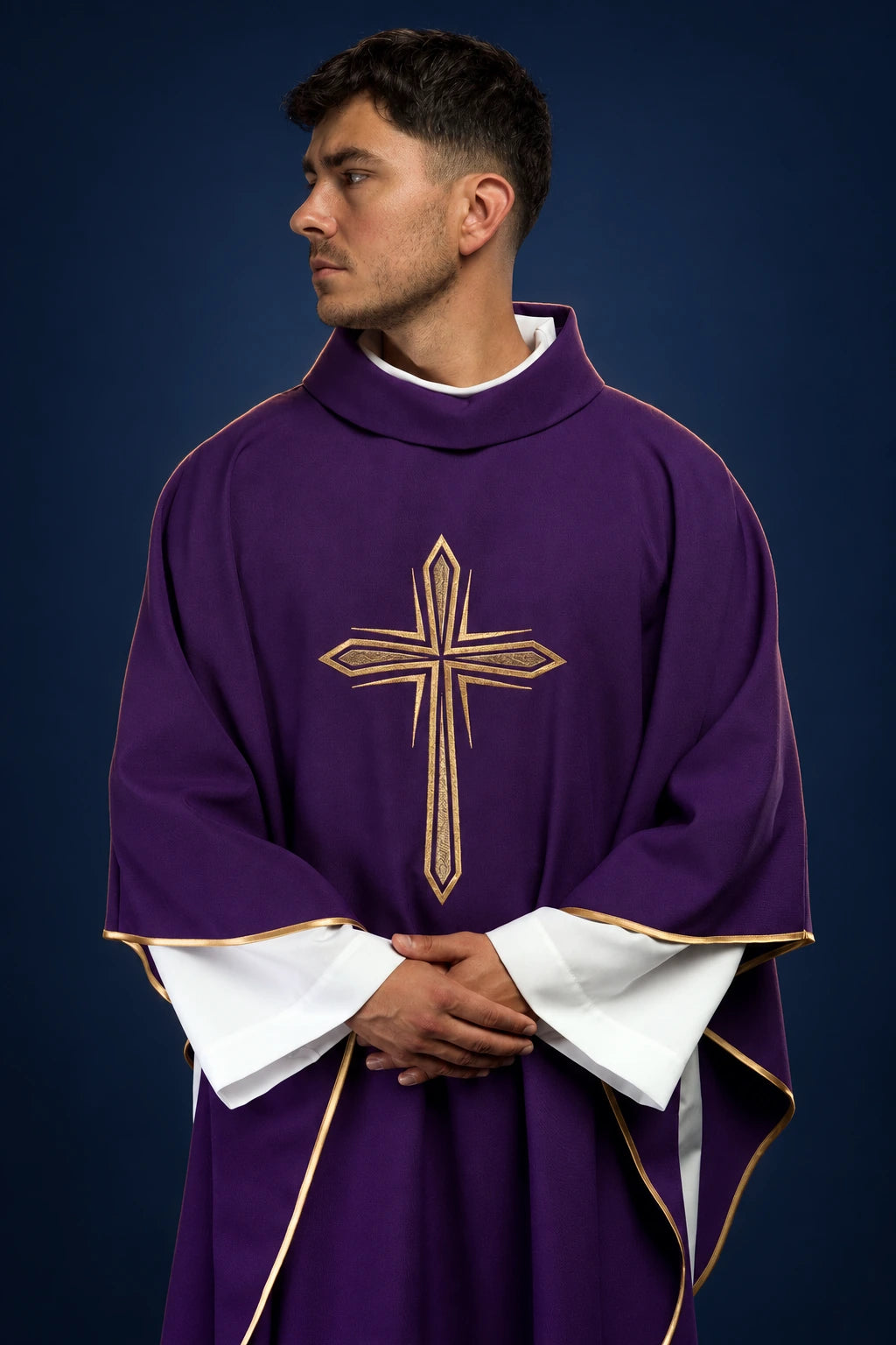 Front view of a purple chasuble with gold cross embroidery and gold trim, worn over white sleeves