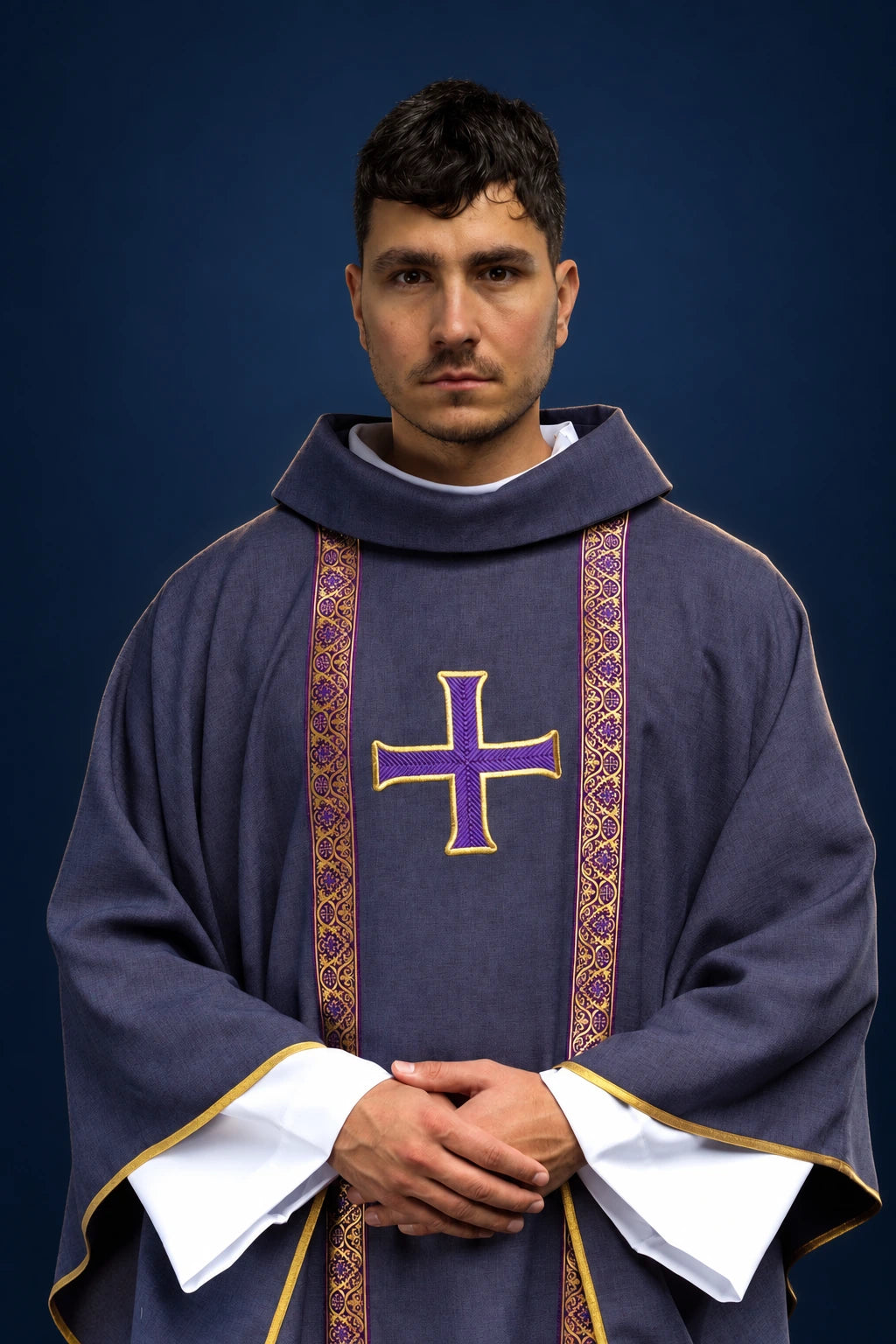 Front view of a purple chasuble with gold-edged embroidered cross and patterned vertical bands