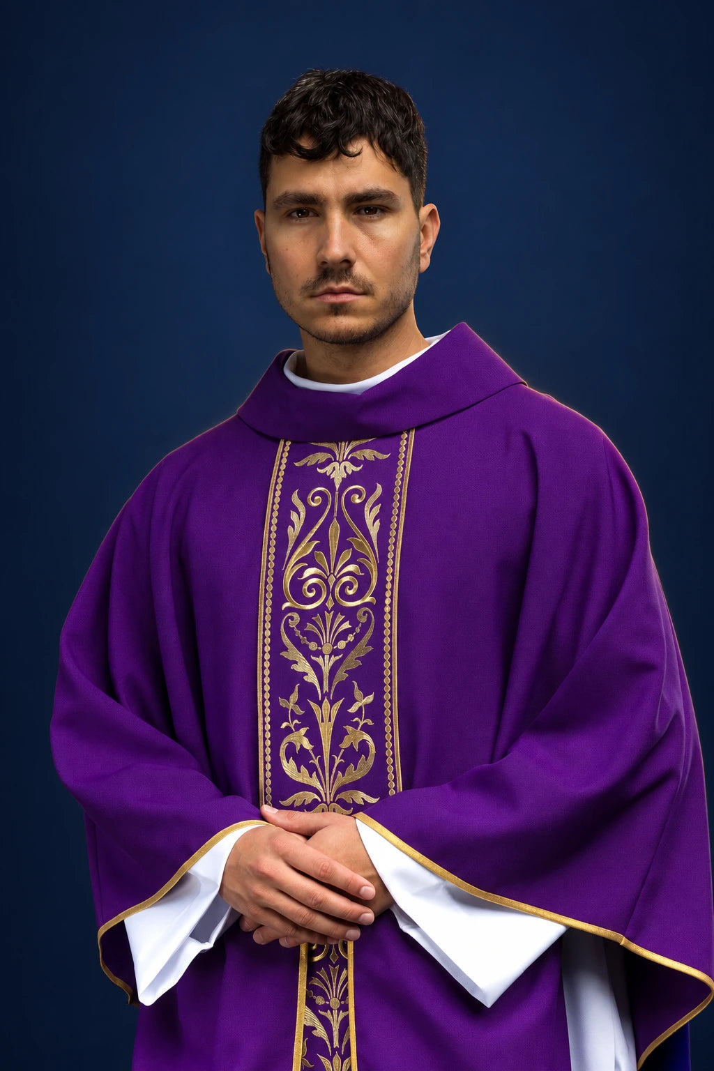 Front view of a purple chasuble with gold embroidered orphrey and gold trim