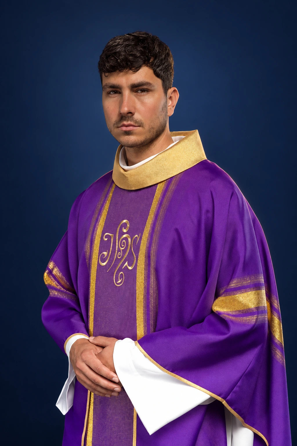Front view of a purple chasuble with gold trim and embroidered IHS on the orphrey