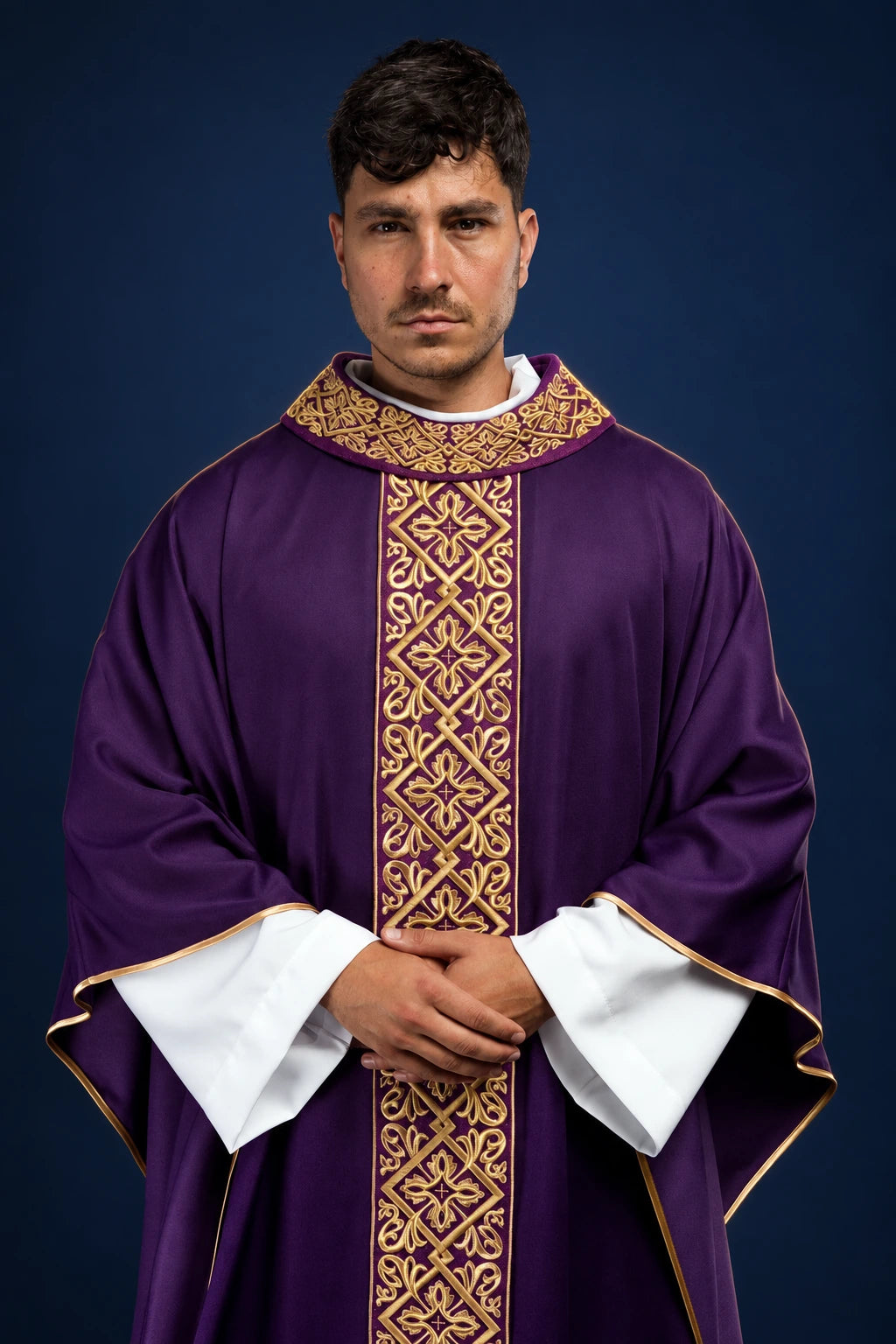 Front view of a purple chasuble with ornate gold floral and cross embroidery down the center and collar