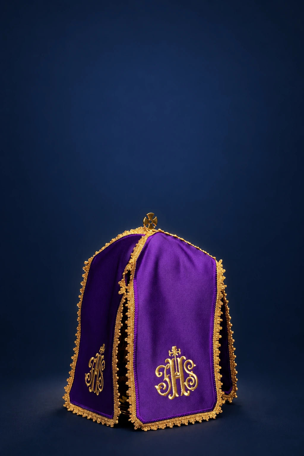 Front view of a purple ciborium veil with gold trim and gold IHS embroidery