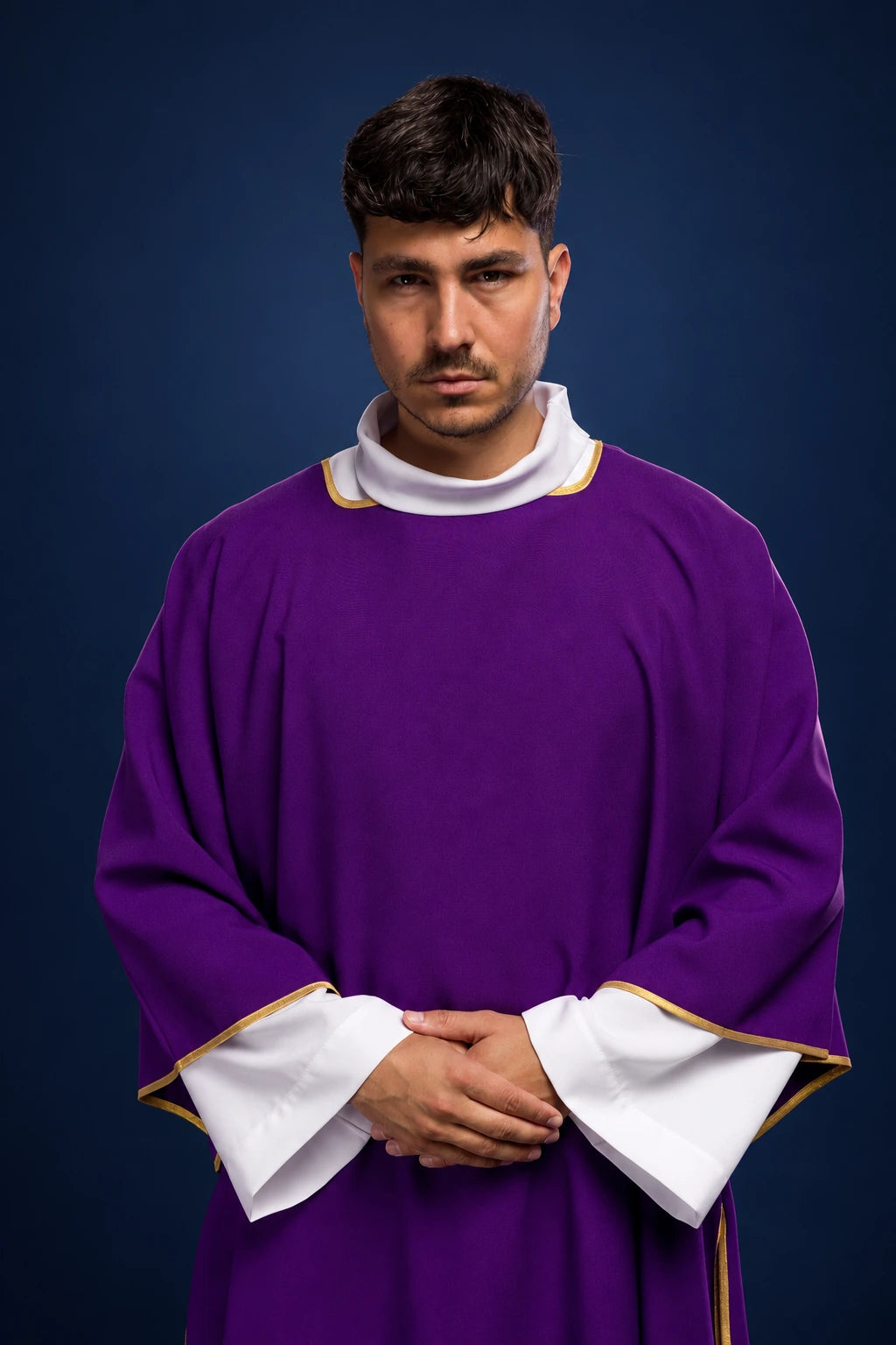 Front view of a purple dalmatic with gold trim and white sleeves, worn over a white alb.