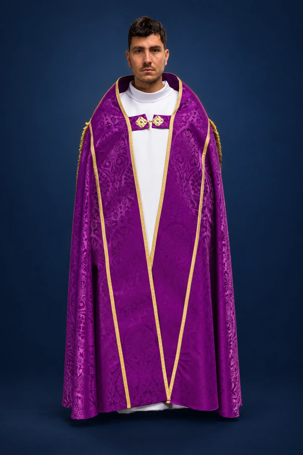 Front view of a purple jacquard Roman cope with gold trim and clasp at the chest
