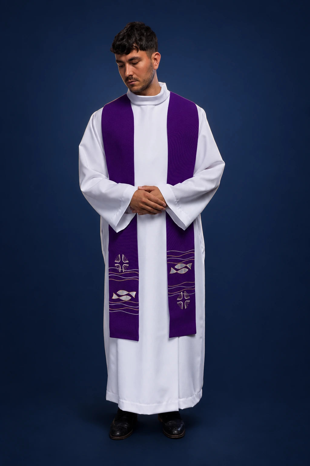 Front view of a purple priest stole with fish and cross embroidery over a white alb